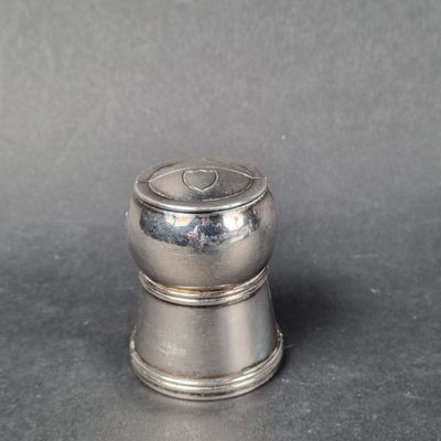 silver plated salt and pepper shaker on a grey background