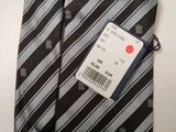 a close up of a tie with a price tag on it