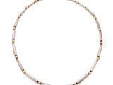 a white and gold beaded necklace on a white background