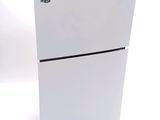 a white sony playstation game console sitting on top of a white table
