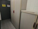 a long hallway in a building with a lot of cupboards