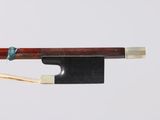 a close up of a violin bow with a string attached to it