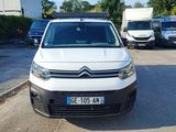 a white van that is parked in a parking lot