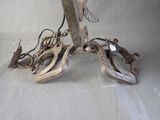 a pair of scissors and a pair of clamps on a table