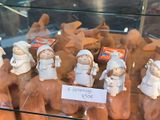 many figurines on display in a glass case