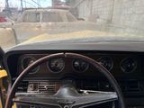 steering wheel and dash of a car in a junkyard