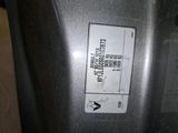a close up of a parking meter with a sticker on it