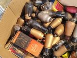 a cardboard box full of different types of batteries