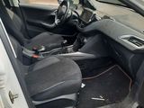 the interior of a car with the door open and the driver ' s seat down