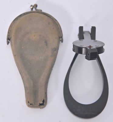 a small purse and a pair of scissors on a table