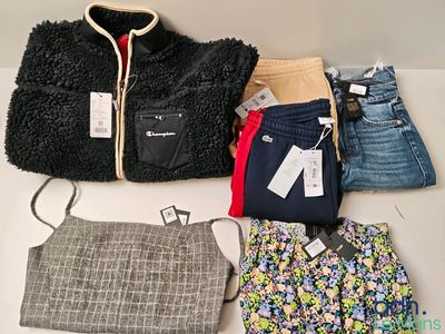 a pile of clothing that is sitting on a table