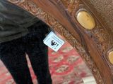 a woman taking a picture of herself in a mirror