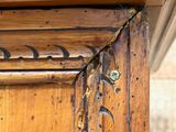 a close up of a wooden frame with a pattern on it