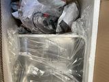 a cardboard box with a bunch of items inside of it