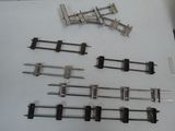 a lot of different types of train tracks on the table