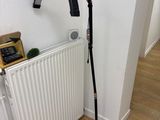 a lamp that is on the floor next to a radiator