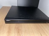a close up of a dvd player sitting on top of a wooden table