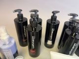 many different types of hair care products on a table