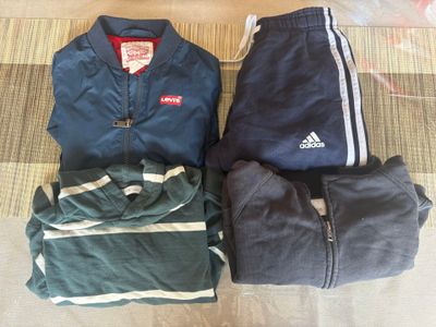 three pieces of clothing laid out on the floor