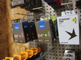 many different types of electronics on display in a store
