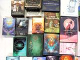 a lot of books that are on the bed together