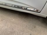 a close up of a car door handle with a sticker on it