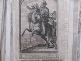 a black and white picture of a man on a horse