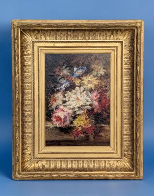 painting of flowers in a gold frame on a blue background