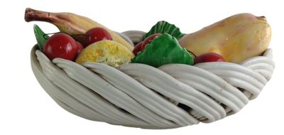 a white basket filled with different types of fruits and vegetables