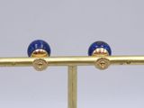 pair of gold and lapis earrings with blue glass beads