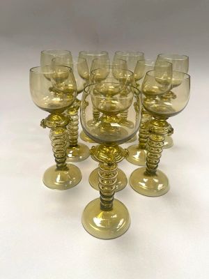six wine glasses sitting on a table next to each other