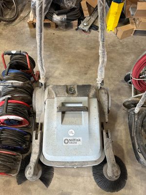 a picture of a hand truck with a broom and a broom
