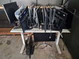 a lot of computers that are sitting on a table