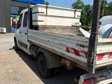 a truck that is parked in front of a kris ' s store