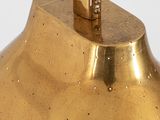 a gold lamp that is sitting on a table