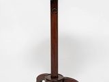 a round table with a wooden base and a metal top