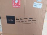 a cardboard box with a sticker on it sitting on the floor