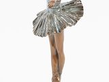 statue of a woman in a tutu with a fan on a black base