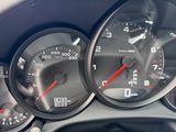 a close up of a car dashboard with gauges and speedometers