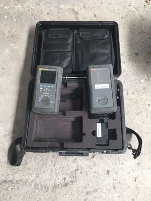a case with two cell phones in it on the ground