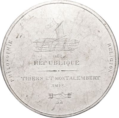the back of a silver coin with a picture of a boat on it