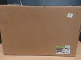 a cardboard box sitting on a table with a sticker on it