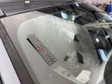 a sticker on the windshield of a car with a ruler on it