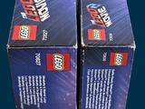 two boxes of legos are stacked on top of each other