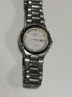 an image of a close up of a wrist watch on a table