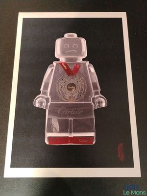 framed photograph of a lego man with a red bandanna around his neck