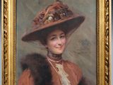 portrait of a lady in a large hat with a fur stole around her neck