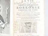 un livre ouvert sur lequel figure le dessin d'un homme tenant une bougie