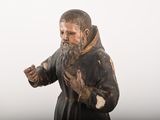 a statue of a man with a beard and a robe