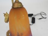 a lamp that is sitting on a white surface